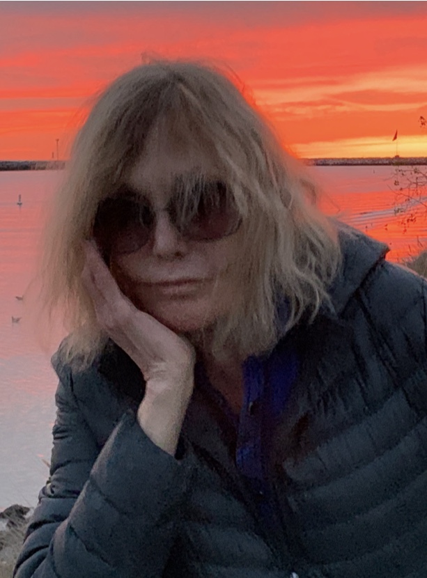 Kim Novak with a dramatic red and orange sky in the background - 2019