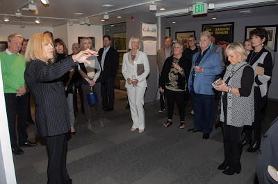 Kim Novak explains her paintings at a private exhibition in Palm Springs